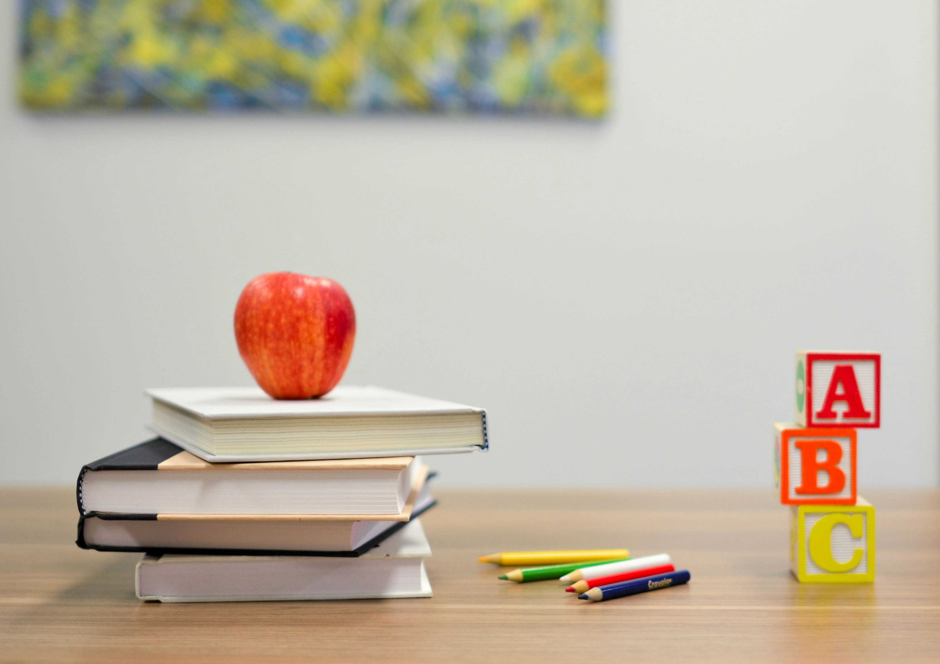 Image of a teacher's desk with alphabet blocks on it